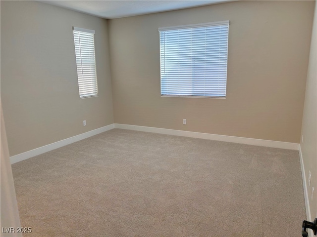 unfurnished room with light carpet