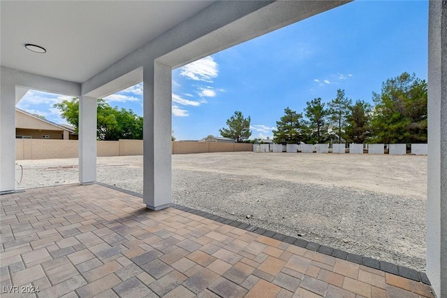 view of patio / terrace featuring fence