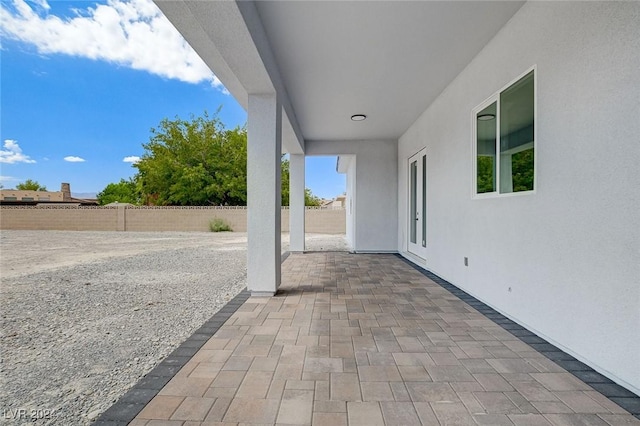 view of patio / terrace featuring fence