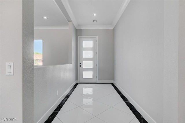 doorway with light tile patterned floors, visible vents, baseboards, and ornamental molding