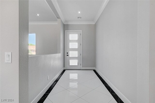 doorway with light tile patterned floors and crown molding