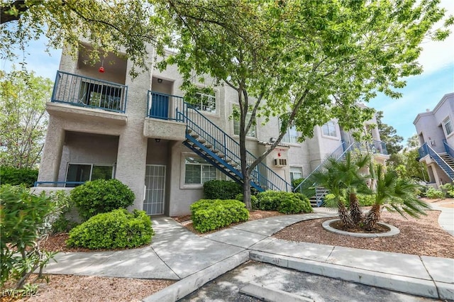 view of property featuring stairway