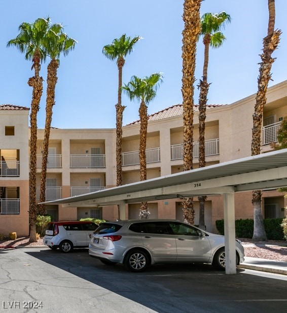 view of property featuring covered parking