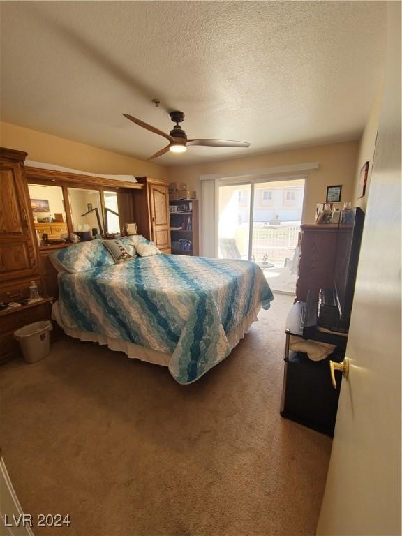 bedroom featuring access to exterior, carpet, ceiling fan, and a textured ceiling