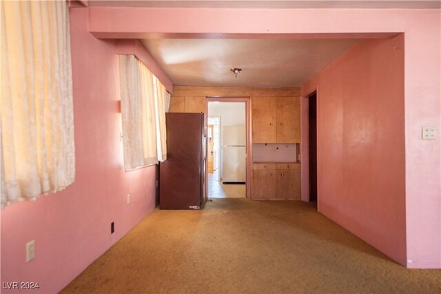 empty room with light colored carpet