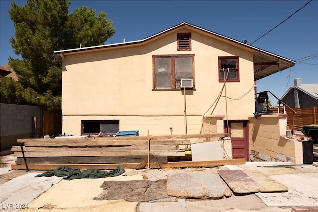 exterior space with fence and stucco siding