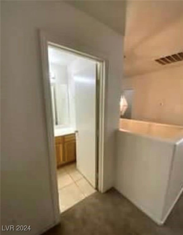 hallway with light tile patterned flooring