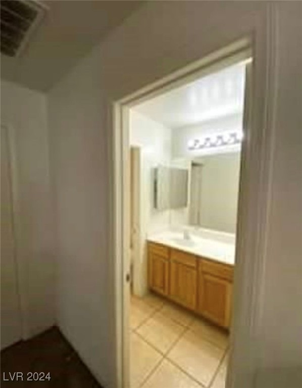 bathroom featuring tile patterned floors and vanity