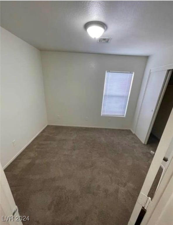 spare room with carpet