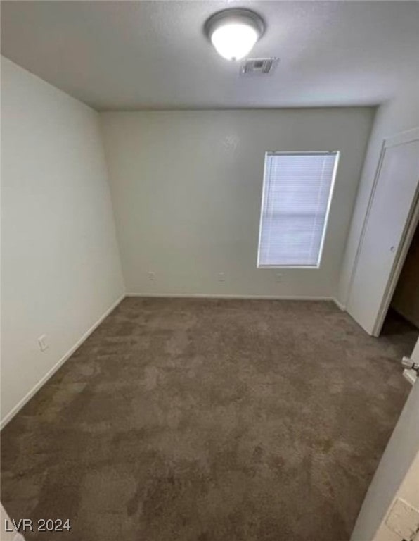 unfurnished room featuring carpet floors