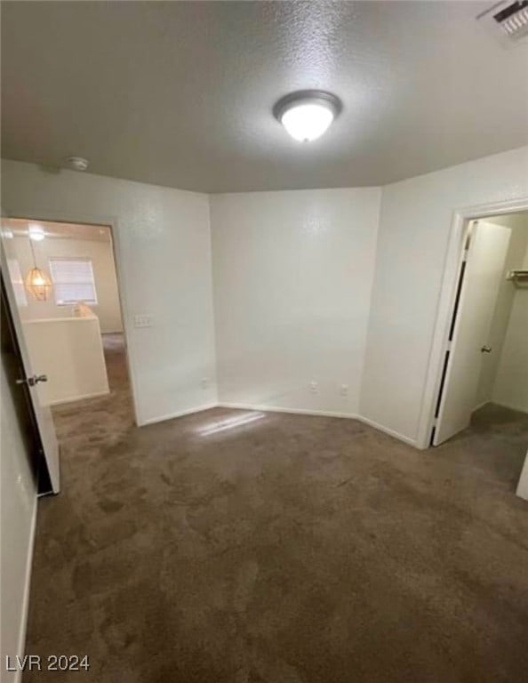 interior space featuring a textured ceiling