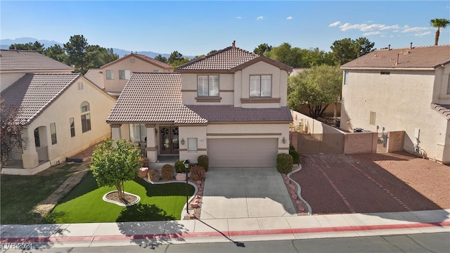 view of front facade with a garage and a front yard