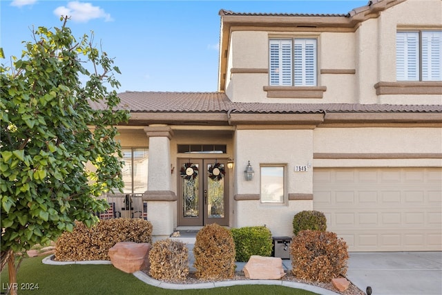 view of front of property with a garage