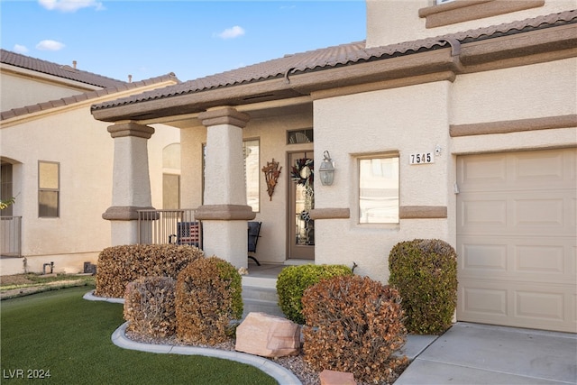 doorway to property featuring a garage