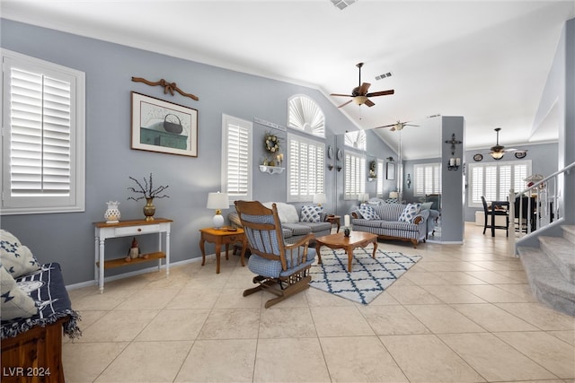 living room featuring ceiling fan, lofted ceiling, and light tile patterned floors