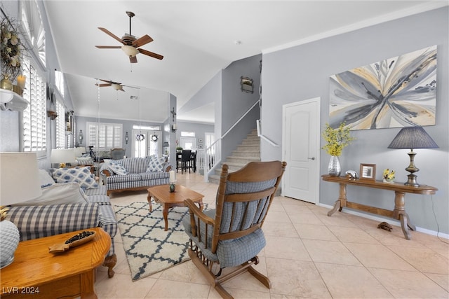 living room featuring ceiling fan, high vaulted ceiling, and light tile patterned flooring