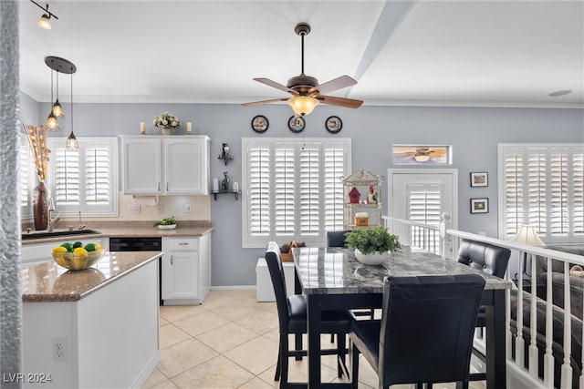 kitchen with ceiling fan, ornamental molding, white cabinets, light stone countertops, and light tile patterned floors