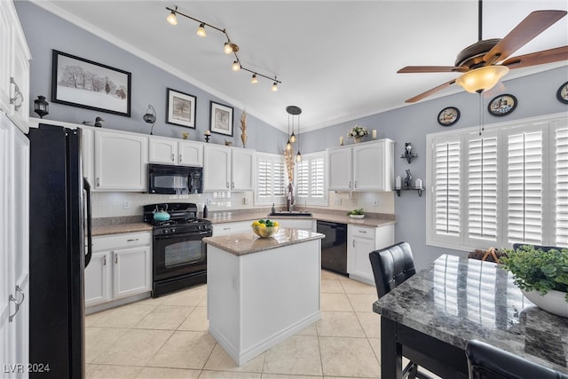 kitchen with plenty of natural light, ceiling fan, decorative backsplash, and black appliances