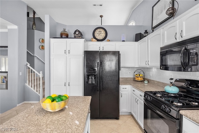 kitchen with decorative backsplash, white cabinetry, black appliances, pendant lighting, and light tile patterned floors