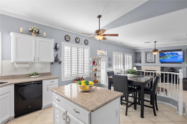 kitchen with black dishwasher, ceiling fan, and a healthy amount of sunlight