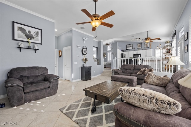 tiled living room with ceiling fan and crown molding