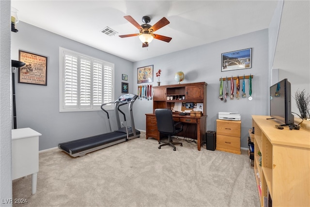 office space featuring ceiling fan and light carpet