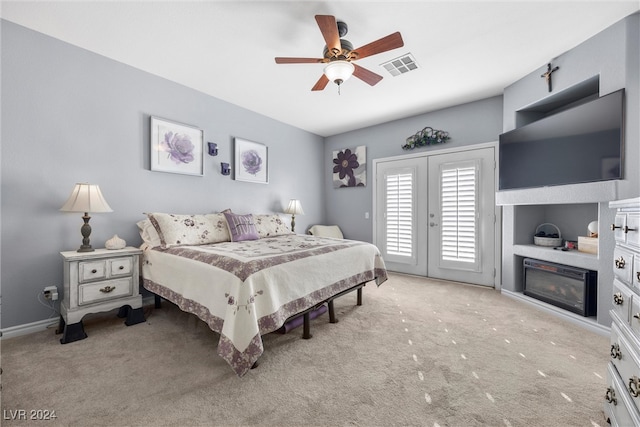 bedroom with ceiling fan, french doors, light colored carpet, and access to outside