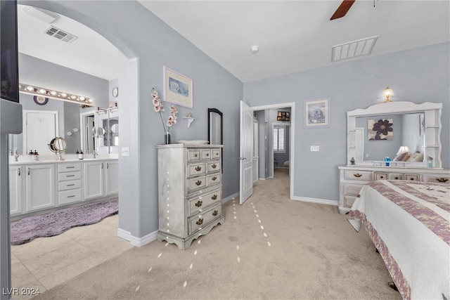 bedroom with ceiling fan and light tile patterned floors