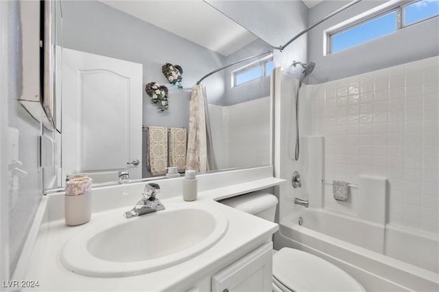 full bathroom with toilet, shower / tub combo, and vanity