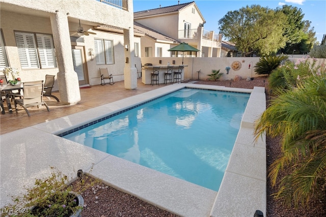 view of pool featuring a patio and ceiling fan