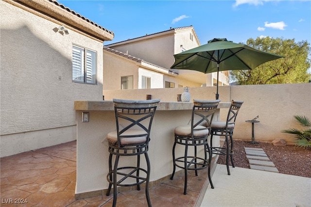 view of patio / terrace featuring a bar