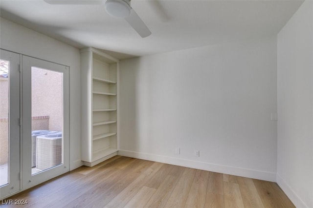 empty room with light wood-style flooring, baseboards, and ceiling fan