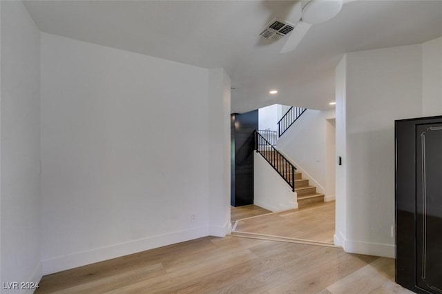 interior space featuring visible vents, baseboards, stairs, and light wood-style floors