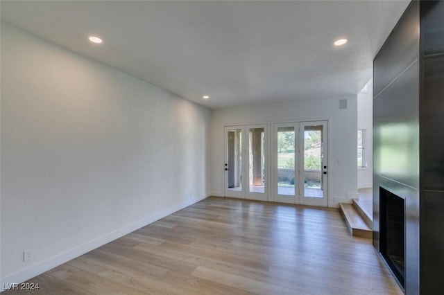 unfurnished living room featuring recessed lighting, visible vents, baseboards, and light wood-style flooring