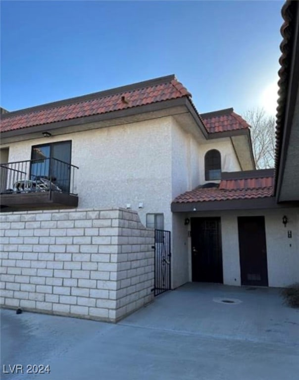 view of home's exterior featuring a balcony