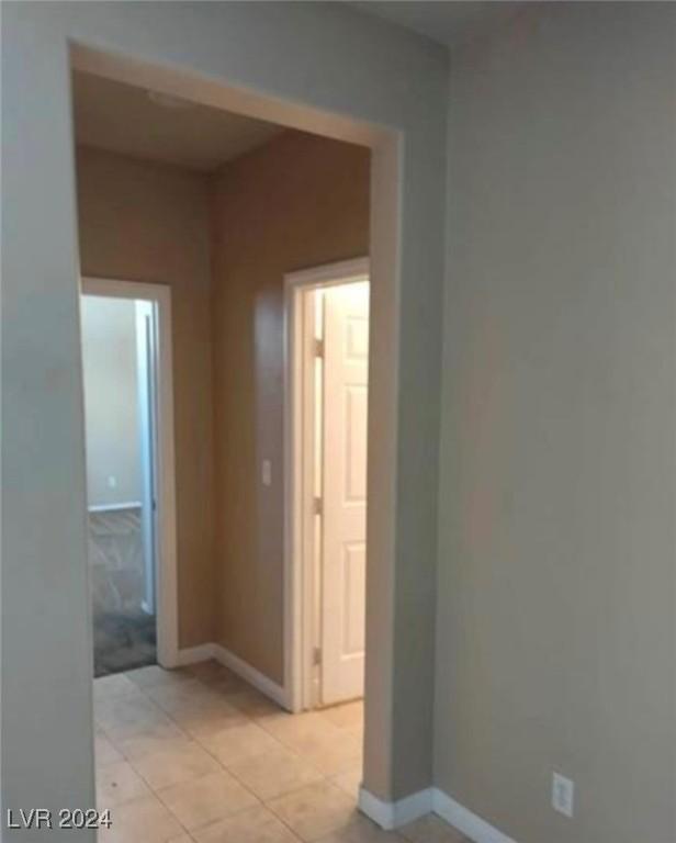 1700 Ravanusa Dr, Henderson, NV 89052 - hall featuring baseboards and light tile patterned floors