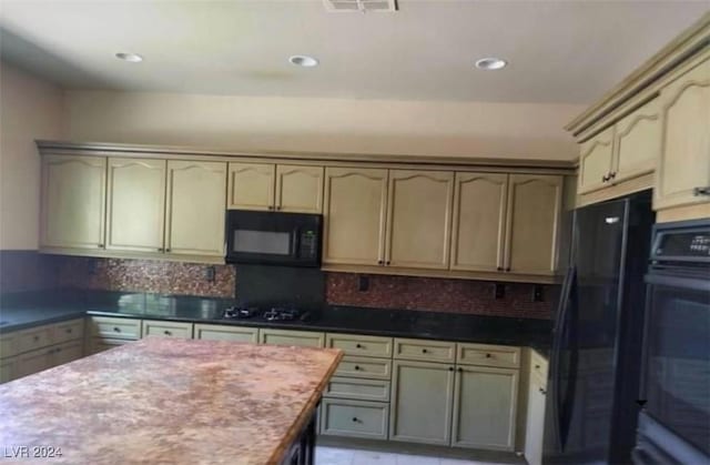 1700 Ravanusa Dr, Henderson, NV 89052 - kitchen with light countertops, decorative backsplash, black appliances, and recessed lighting