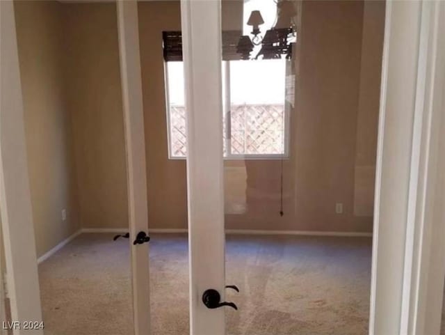 1700 Ravanusa Dr, Henderson, NV 89052 - carpeted empty room with baseboards