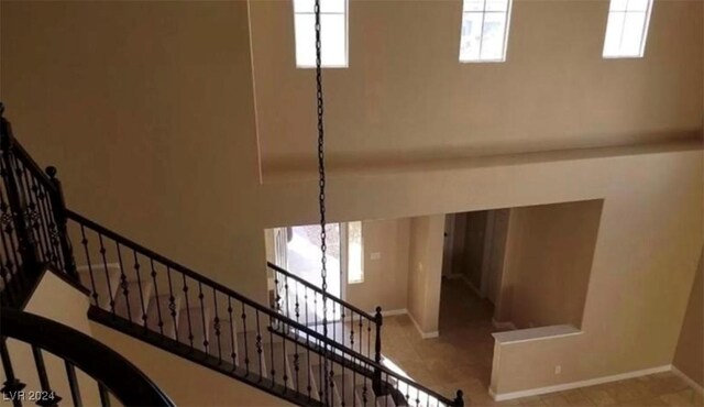 1700 Ravanusa Dr, Henderson, NV 89052 - stairway featuring baseboards and a wealth of natural light