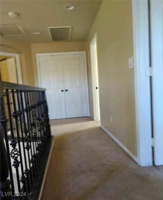 1700 Ravanusa Dr, Henderson, NV 89052 - hallway featuring carpet floors, baseboards, an upstairs landing, and visible vents
