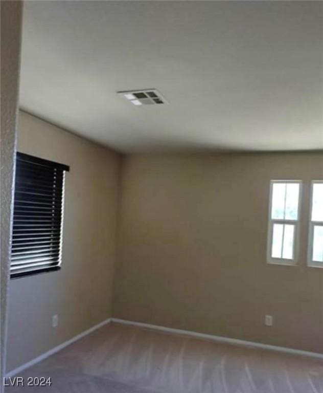 1700 Ravanusa Dr, Henderson, NV 89052 - carpeted spare room with baseboards and visible vents