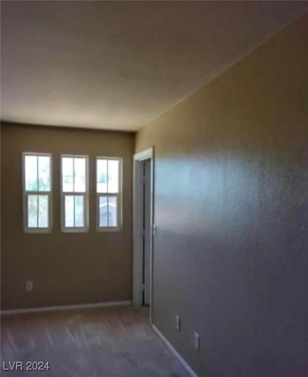 1700 Ravanusa Dr, Henderson, NV 89052 - carpeted spare room featuring baseboards