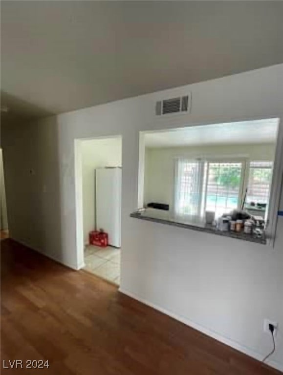 unfurnished room with light hardwood / wood-style floors