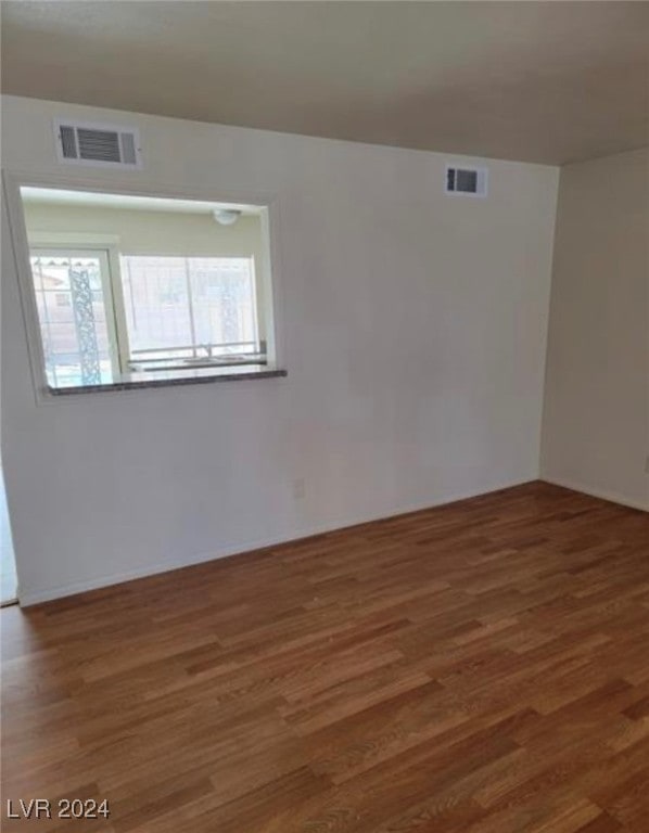 empty room featuring hardwood / wood-style floors