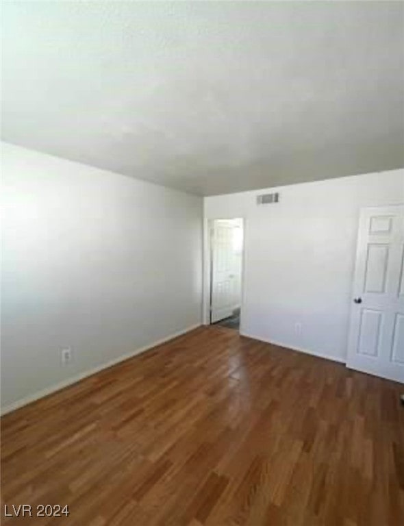 empty room featuring hardwood / wood-style flooring