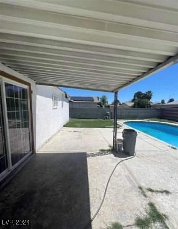 view of patio featuring a fenced in pool