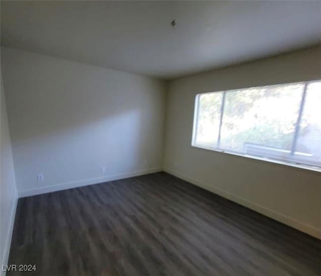 empty room with wood-type flooring