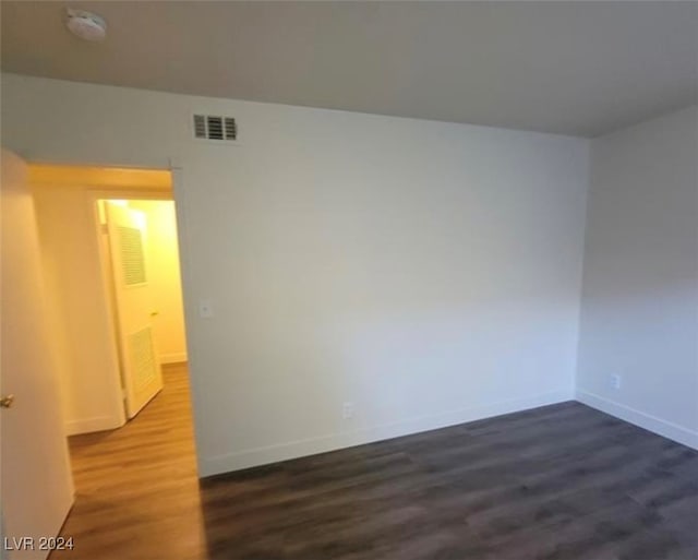 spare room with wood-type flooring