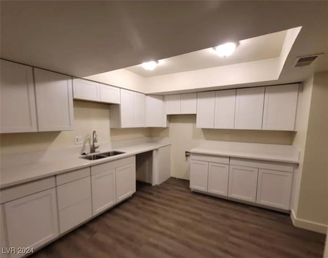 kitchen featuring white cabinetry, sink, and dark hardwood / wood-style flooring