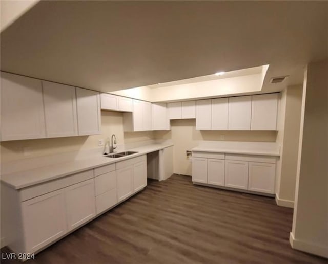 kitchen featuring sink, dark wood-type flooring, and white cabinets